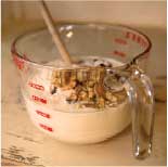 Mixing the dough in a glass measuring cup.
