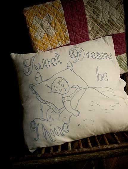 A pillow embroidered with 'Sweet Dreams Be Thine'. Good night!
