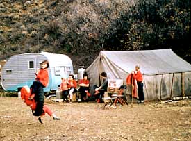 Mary Jane as a kid with family, camping with a big canvas tent