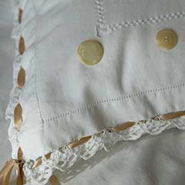 Tablecloth Pillow (square) with crocheted edges and ribbon woven through