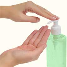 Sanitizing hands using a bottle of hand sanitizer
